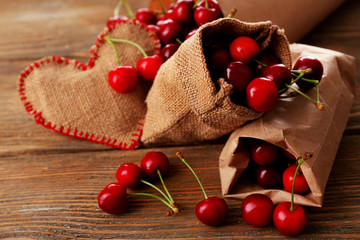 Wall Mural - Sweet cherries on wooden table