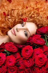 Wall Mural - Woman with permed red hair and beautiful red roses