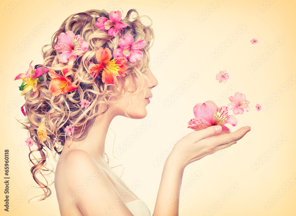 Beauty girl takes beautiful flowers in her hands - obrazy, fototapety, plakaty 