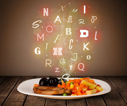 Fresh cook food with colorful letters on wood