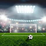 Fototapeta Sport - Soccer ball on green stadium arena