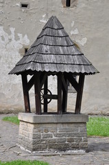 Wall Mural - Old stone well in Cerveny klastor