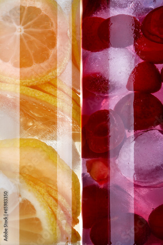 Naklejka ścienna iced drinks with cherry and orange as background