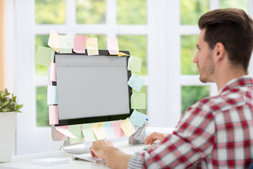 Man looking at a computer monitor