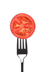 Wall Mural - Red juicy tomato on fork.