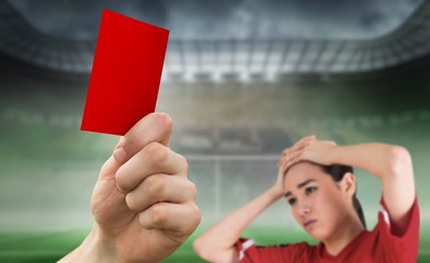 Poster - Composite image of hand holding up red card