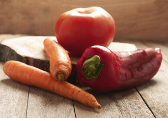 Wall Mural - Vegetable on wood background close up