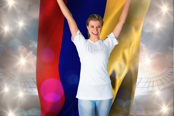 Canvas Print - Composite image of pretty football fan in white cheering holding