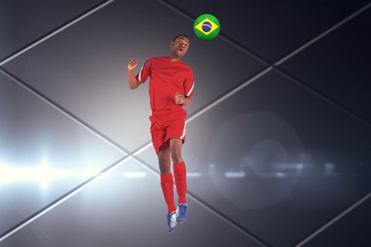 Composite image of football player in red jumping