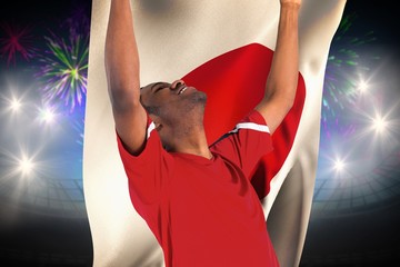 Aufkleber - Composite image of excited handsome football fan cheering