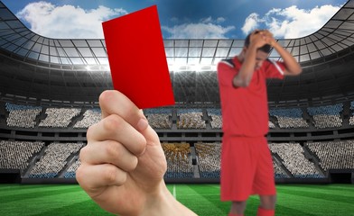 Aufkleber - Composite image of hand holding up red card to player