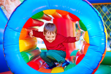 Wall Mural - happy kids playing on inflatable attraction playground