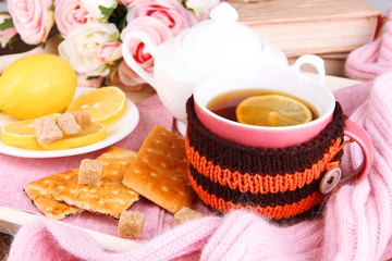 Aufkleber - Cup of tea with lemon in scarf close up
