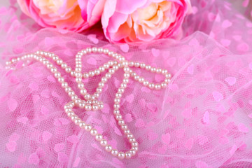 Canvas Print - Beautiful pearls on pink cloth