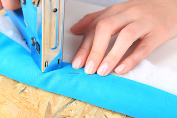 Poster - Fastening fabric and board using construction stapler