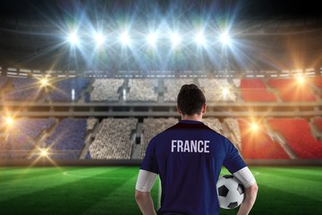Poster - Composite image of france football player holding ball