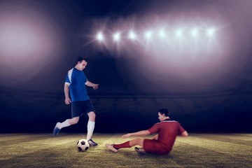 Aufkleber - Composite image of football players tackling for the ball