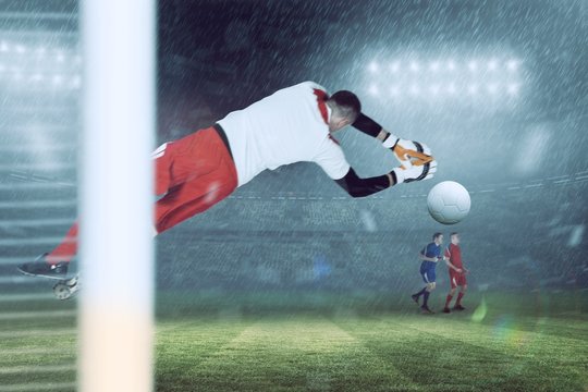 Composite image of fit goal keeper jumping up