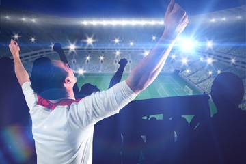 Aufkleber - Composite image of excited football fan cheering