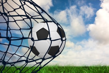 Aufkleber - Composite image of football in back of the net