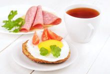 Sandwich With Fried Egg, Tomato Slices And Tea