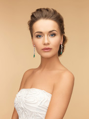 woman wearing shiny diamond earrings