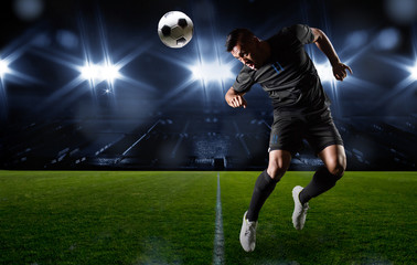 hispanic soccer player heading the ball