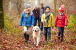 © Monkey Business - Family Walking Dog Through Winter Woodland