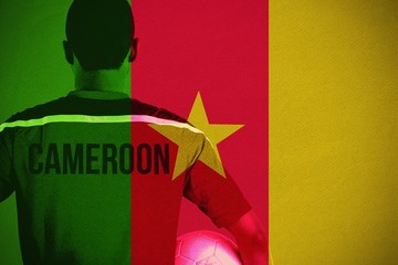 Sticker - Composite image of cameroon football player holding ball