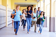 © Monkey Business - Group Of High School Students Running In Corridor