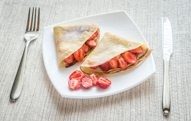 Wall Mural - Crepes with fresh strawberries