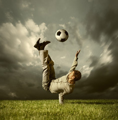 Man in casual suit playing in football