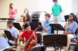 © Monkey Business - Pupils Playing Musical Instruments In School Orchestra