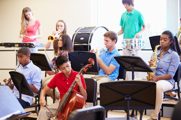 Wall Mural - pupils playing musical instruments in school orchestra