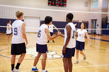 Wall Mural - high school volleyball match in gymnasium