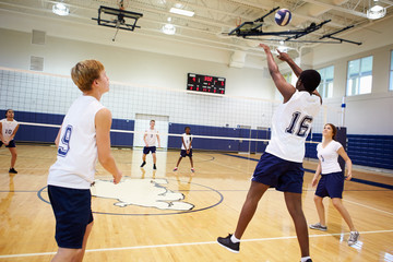 Wall Mural - high school volleyball match in gymnasium