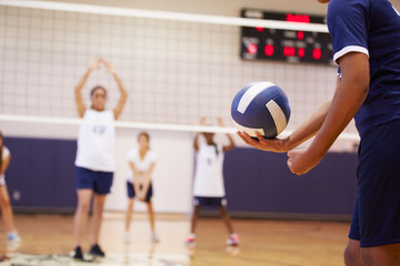 Wall Mural - high school volleyball match in gymnasium