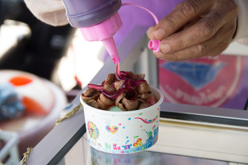 jam pouring into a bowl of nutritious and delicious coco flake c