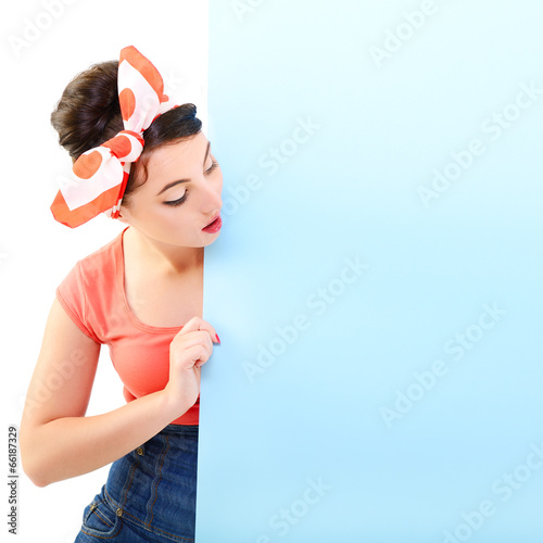 Pinup girl holding empty banner, portrait of young happy sexy wo Wallpaper Mural