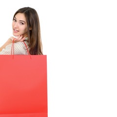 beautiful happy girl shopaholic with red shopping bags, over whi