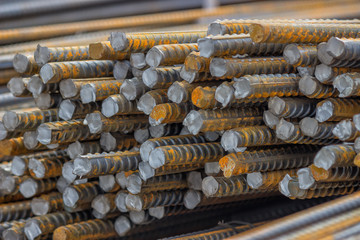 Stack of steel reinforcement rods background 2