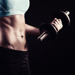 © beccarra - Fitness woman holding dumbbell
