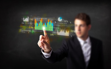 Poster - Young business person touching colorful charts and diagrams