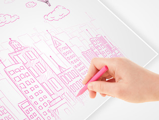 Fototapete - A person drawing sketch of a city with balloons and clouds on a