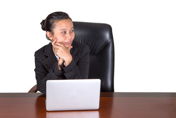 Asian businesswoman at her office desk over white background