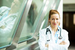 © pathdoc - Portrait female doctor standing in hospital hallway