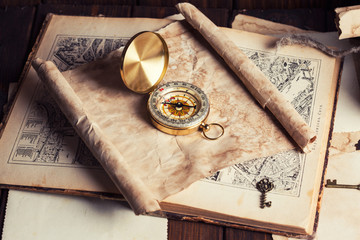 compass and old map on wooden table