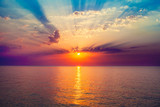 Fototapeta Zachód słońca - sunrise in the sea