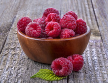 Healthy Organic Raspberries In A Bowl On The Old Rustic Table