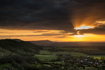 Wall Mural - Stunning Summer sunset across countryside landscape with dramati